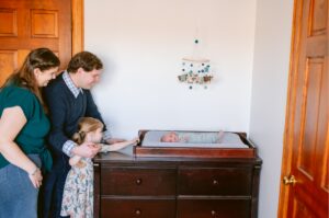 Siblings with newborns during newborn session