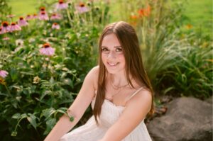 Close-up senior picture of a girl with natural sunlight and soft background in Shakopee MN.