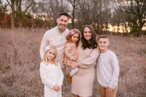 Fall family photos in tall grasses in Maple Grove, MN