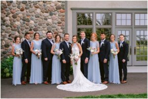 ourtney and Drew with their wedding party at Rush Creek Golf Club in Maple Grove