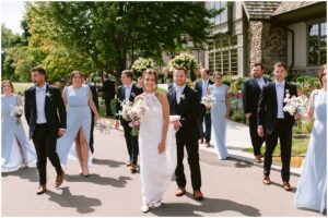 Courtney and Drew with their wedding party at Rush Creek Golf Club in Maple Grove